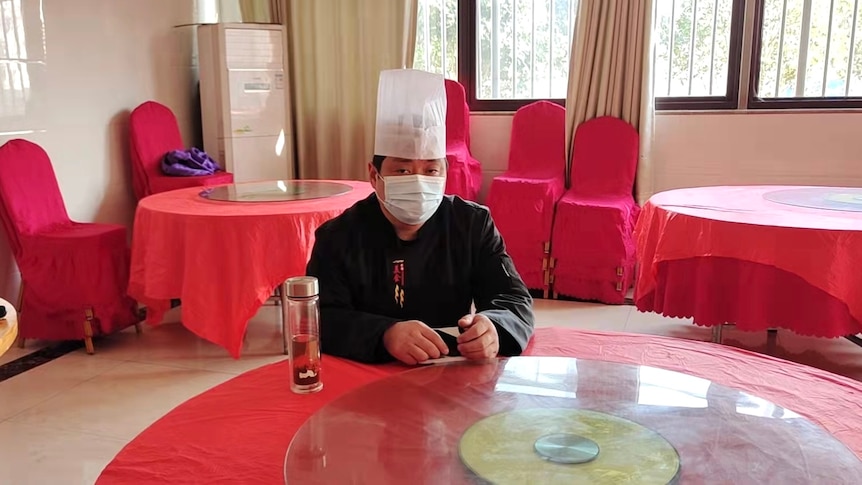 WANRU ZHANG IN HIS RESTAURANT