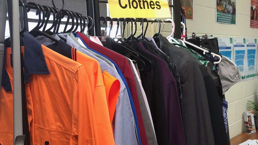 A rack of clothes under a sign 'Interview clothes' in Sunnybank High School's Year 13 classroom.