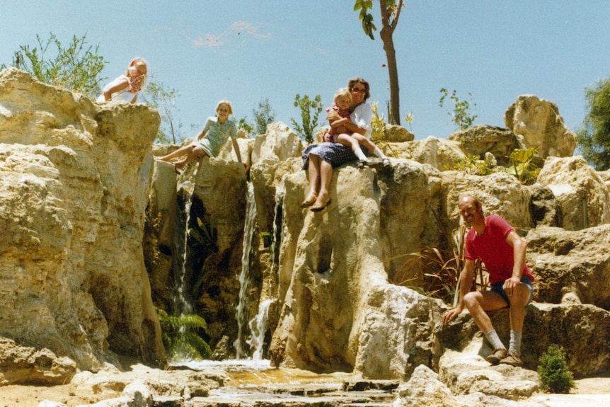 The Puik family on the limestone waterfall feature in 1980
