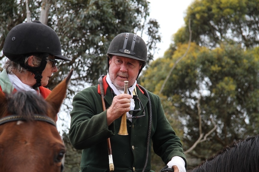 Richard Palmer prepares to blow the horn