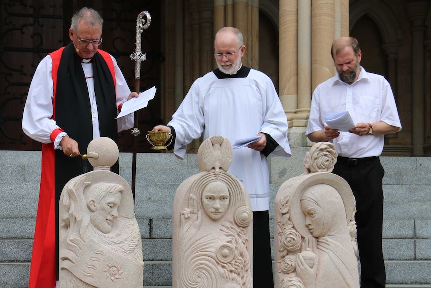 Brisbane Archbishop Phillip Aspinall blesses the statues