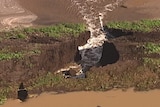 Water gushing through a hole in a 430 megalitre irrigation dam in southern Queensland.