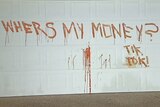 'Wheres my money? Tik tok? scrawled on the garage door of an Arundel home on June 17, 2014.