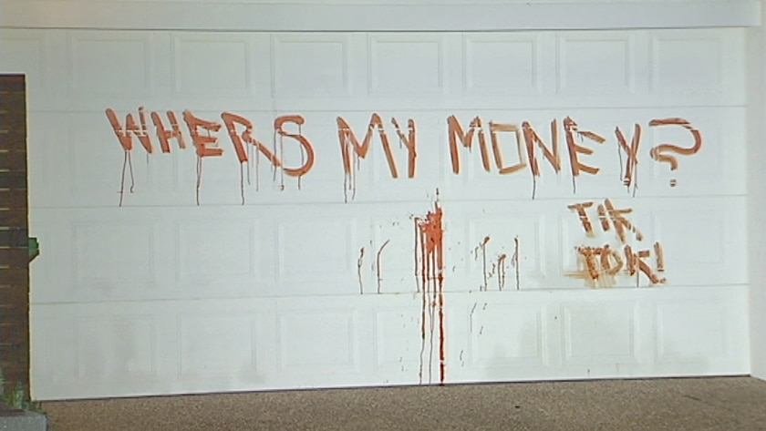 'Whers my money? Tik tok! scrawled on the garage door of an Arundel home on June 17, 2014.