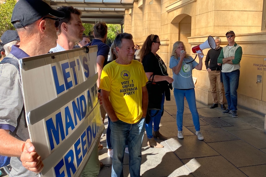Supporters of nurse and AFLW player Deni Varnhagen outside the court.