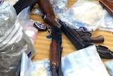 A collection of seized drugs and guns found by police in the Northern Territory