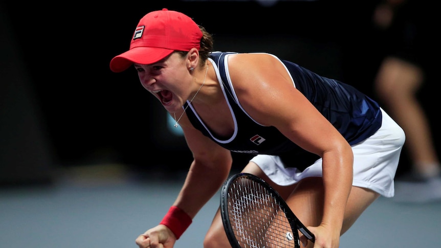 Ash Barty lets out a joyous roar after winning the WTA Finals decider against Elina Svitolina.