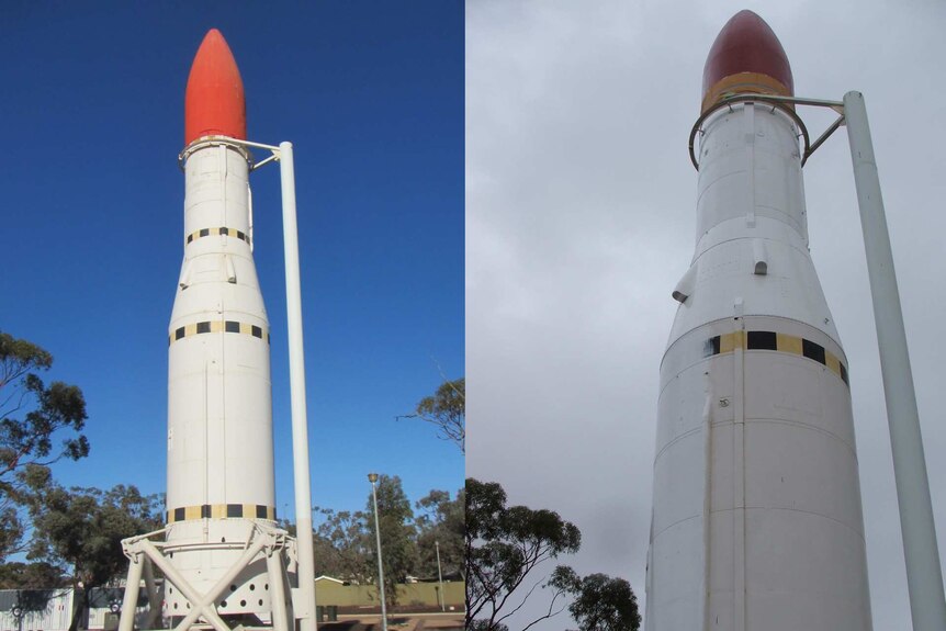 A large white missile with a red nose points to the sky in both photos which compares before and after the paint job.