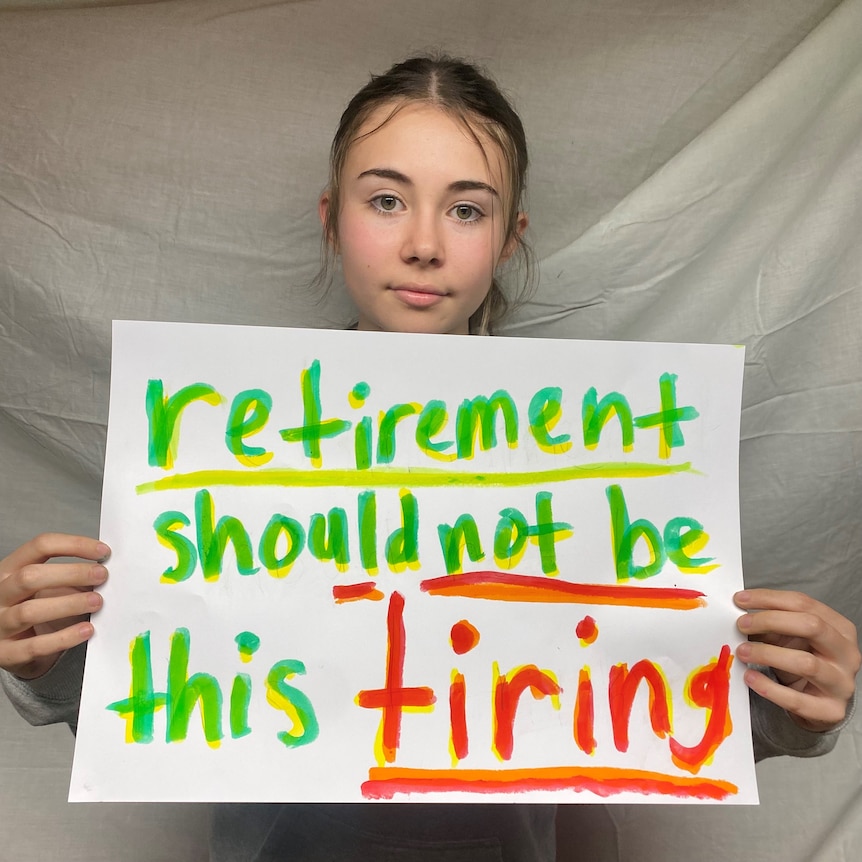 young girl holding sign saying retirement should not be this tiring