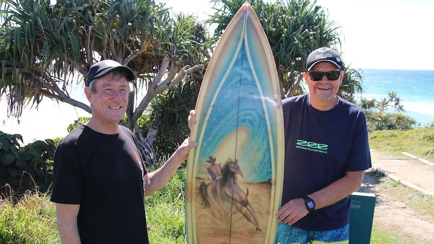 Bill Gibson (left) and Peter Gilson with the stolen surfboard