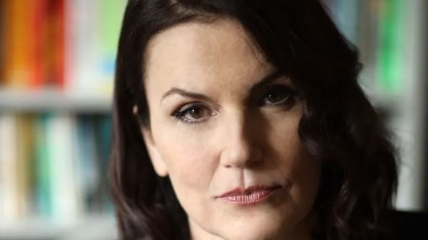 A profile image of a white woman with dark brown hair.