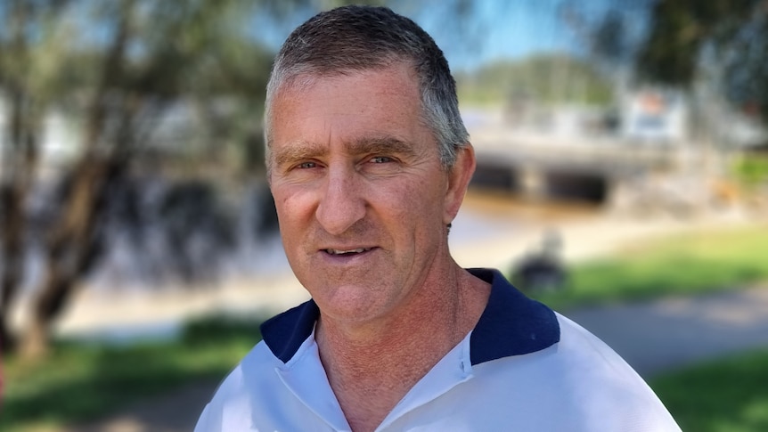 A man wearing a collared shirt.