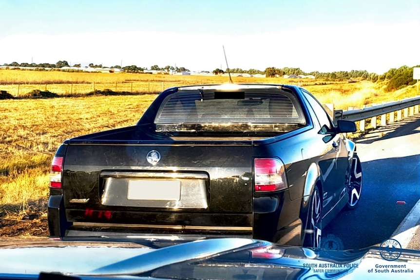 A black Holden ute.