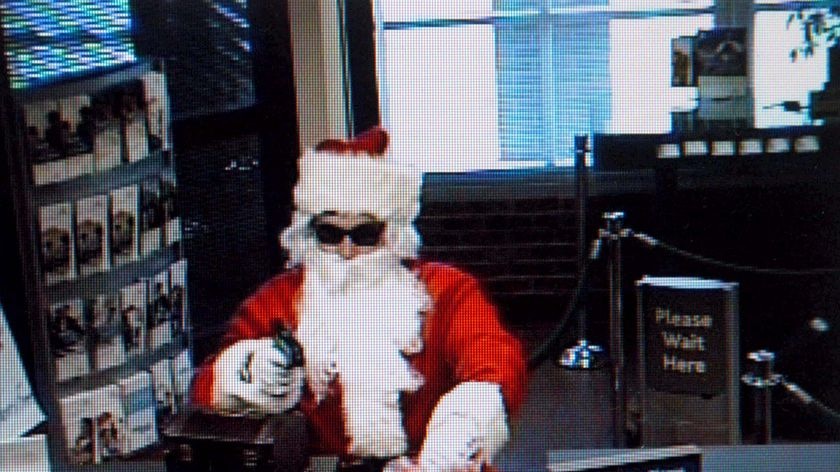 A man dressed as Santa brandishes a gun as he holds up a bank in Nashville, Tennessee