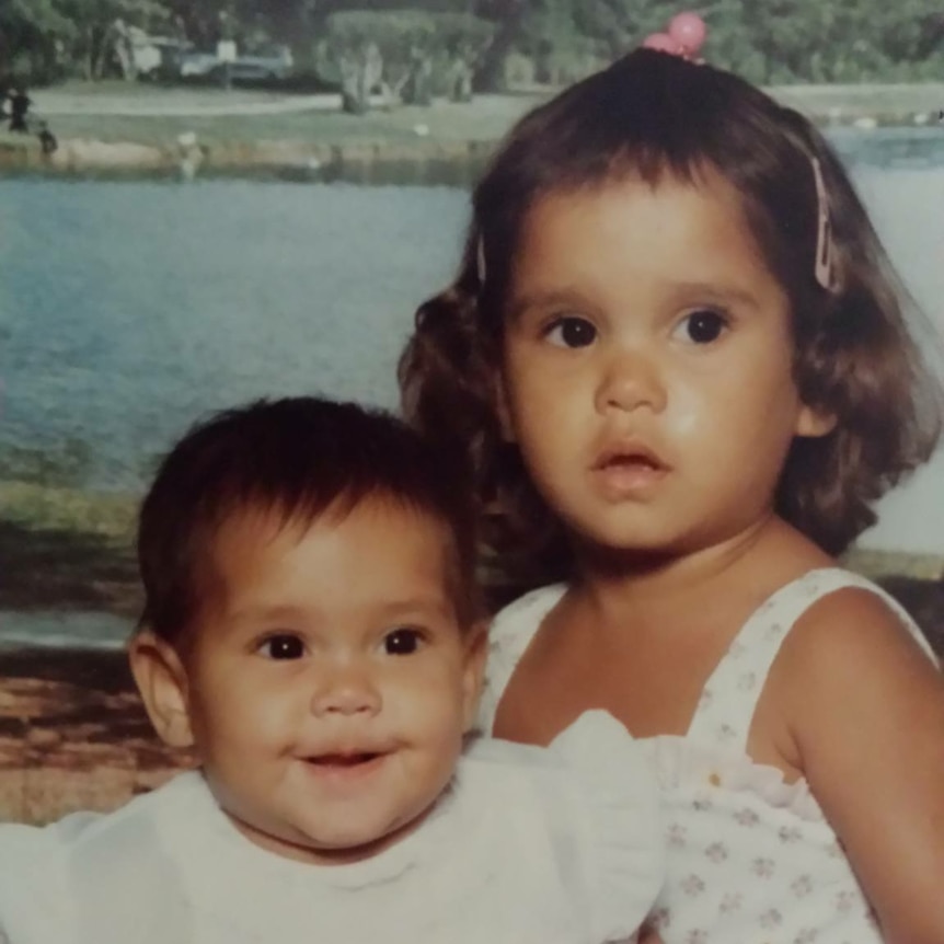 Two little girls pose for portrait photo