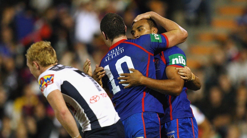 Mark Taufua is congratulated after scoring a try