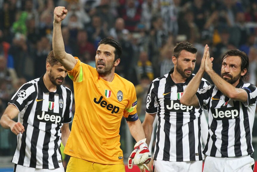 Gianluigi Buffon celebrates with Juventus teammates