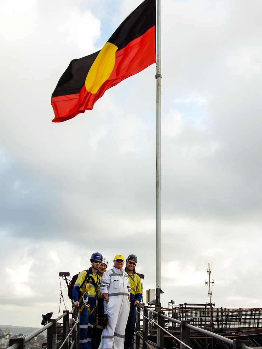 The Aboriginal flag flying over the Sydney Harbour Bridge on Apology Day.