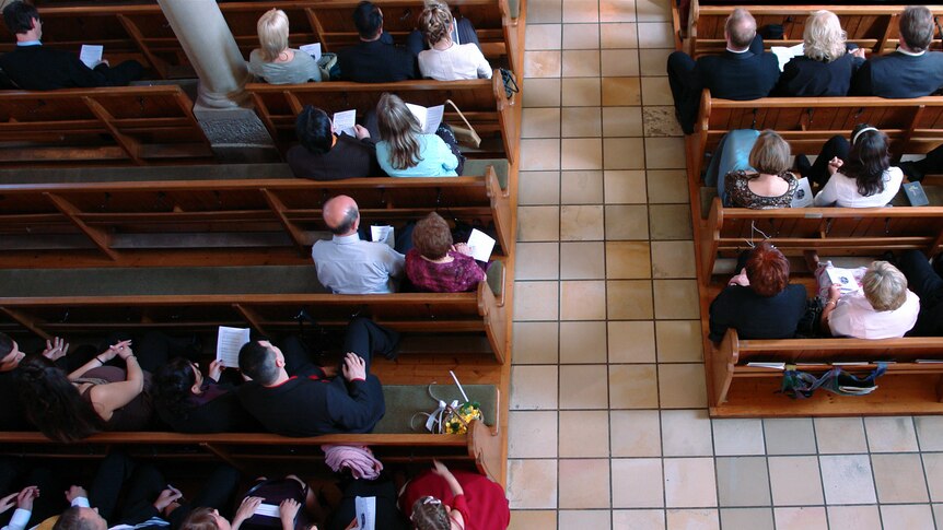 birds eye view of church attendees sitting in pews
