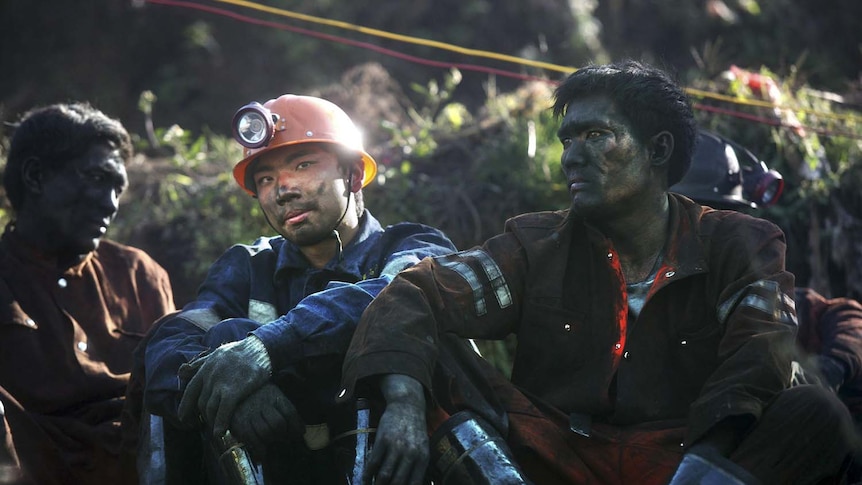 Hope fades: rescuers at the Sizhuang mine.