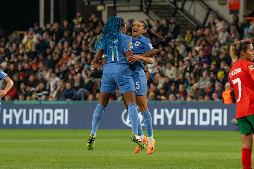 Kadidiatou Diani and Kenza Dali bump chests after a goal in the FIFA Women's World Cup game against Morocco.