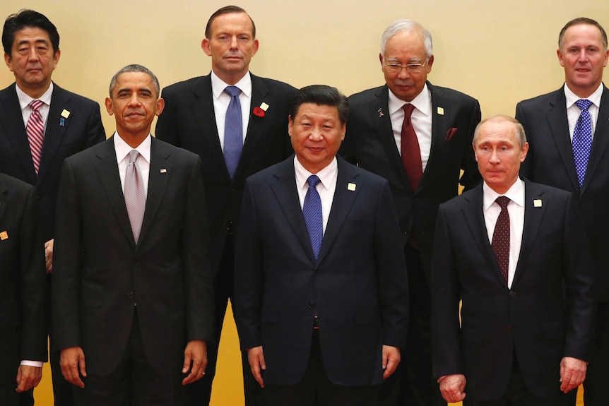 APEC leaders pose for a photo in Beijing on November 11.