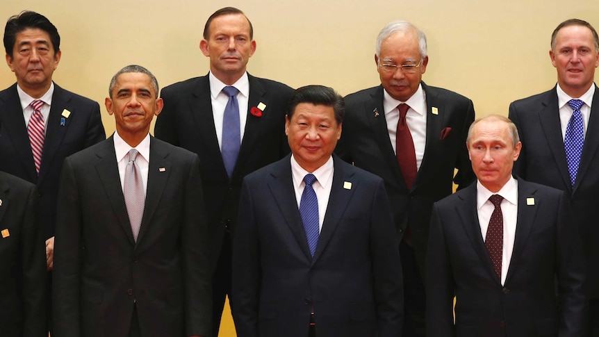 APEC leaders pose for a photo in Beijing on November 11.