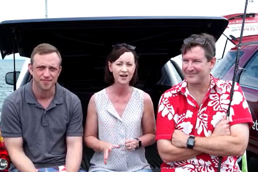 Queensland MPs Steven Miles, Yvette D'Ath and Chris Whiting sit in the back of a car