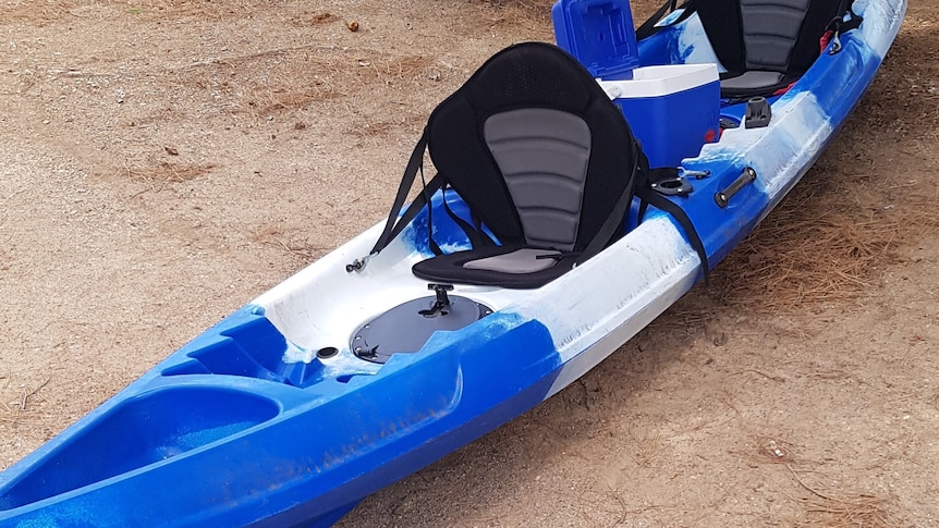 A blue and white kayak
