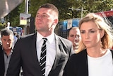 Sydney Rooster NRL player Shaun-Kenny Dowall (left) arrives at Downing Centre District Court