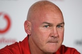 The St George Illawarra NRL coach looks towards a camera during a media conference after a match against the Warriors.