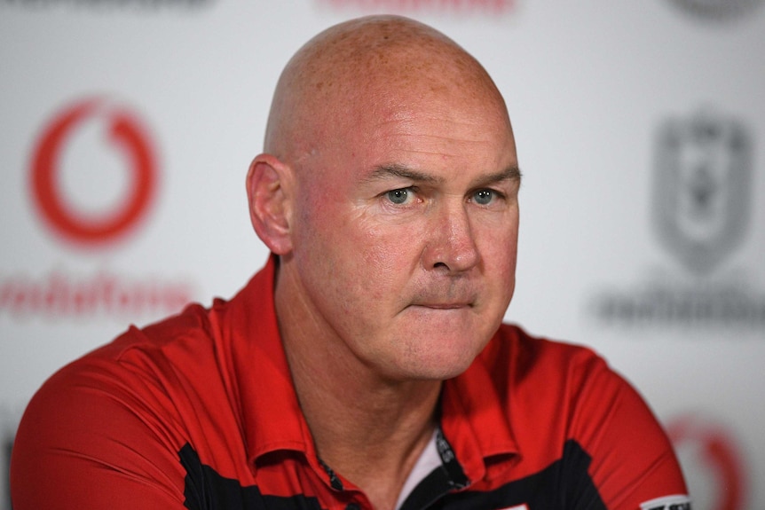 The St George Illawarra NRL coach looks towards a camera during a media conference after a match against the Warriors.
