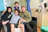 A group of people on a sofa in hospital