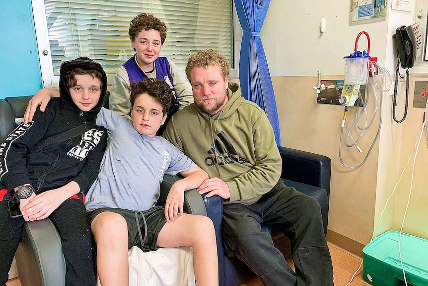 A group of people on a sofa in hospital