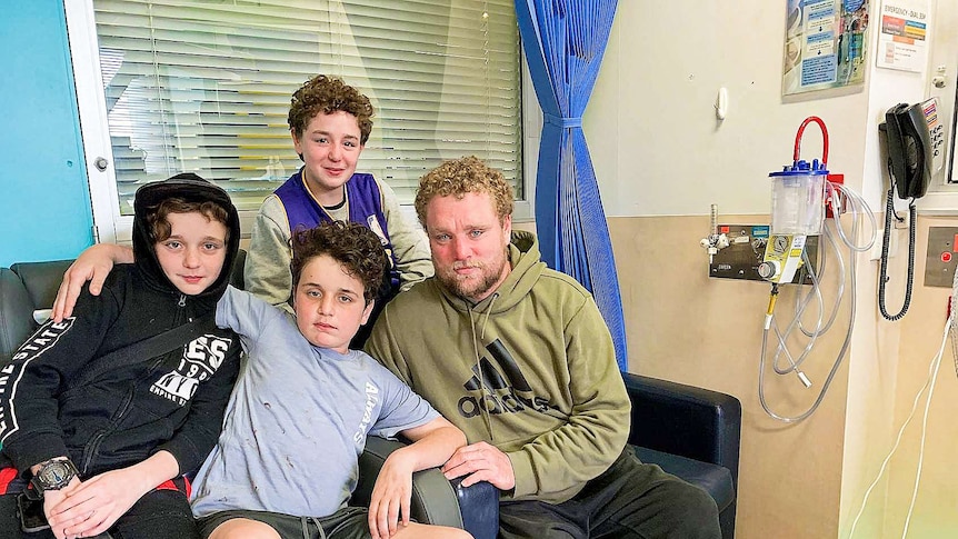 A group of people on a sofa in hospital