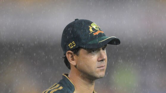 Ricky Ponting leaves the field in the rain