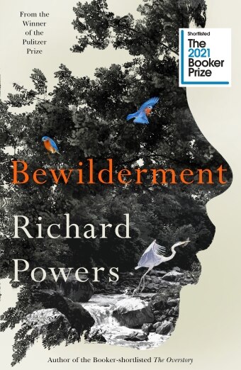 The book cover of Bewilderment by Richard Powers, an outline of a woman's face cut out from a photograph of a forest