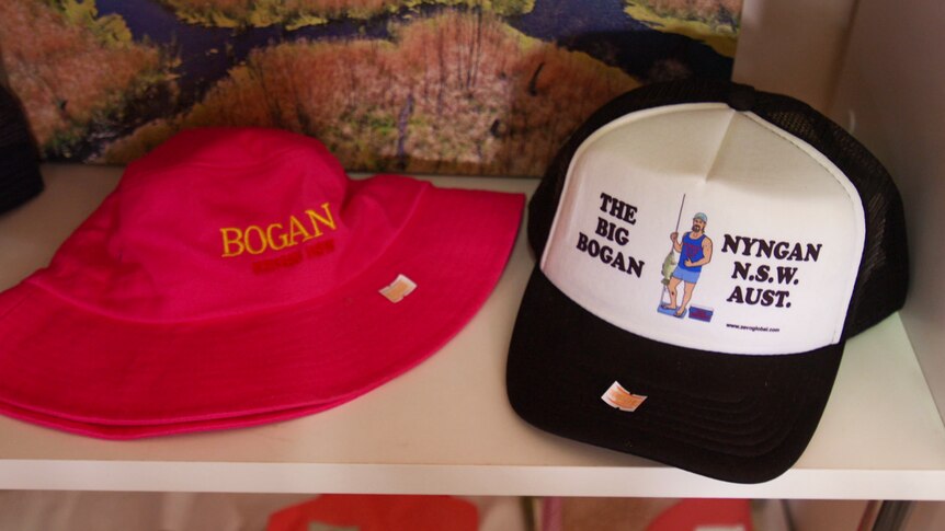 A brim hat and a cap read: 'Bogan' and 'The Big Bogan' Nyngan NSW AUST