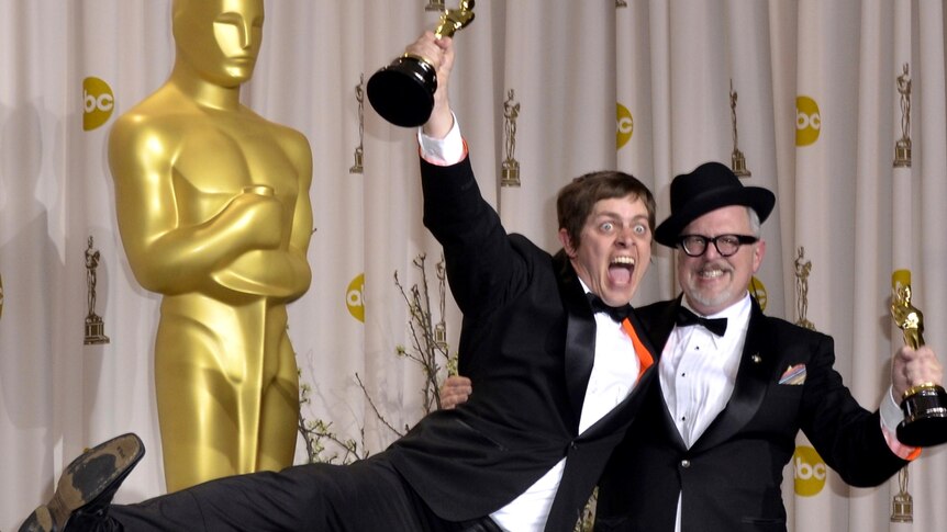 William Joyce and Brandon Oldenburg celebrate with their Oscars.