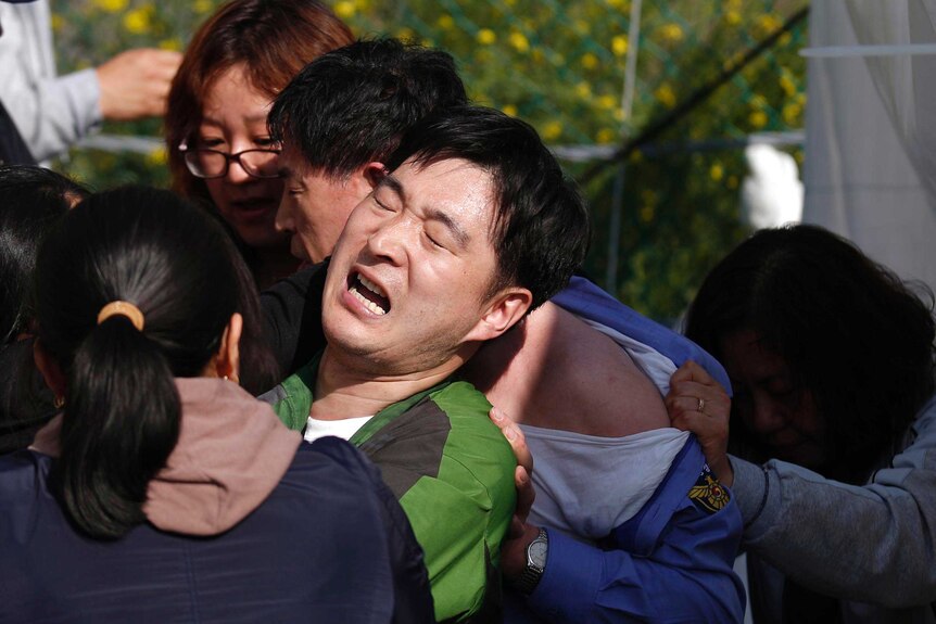 Relatives confront South Korean officials over ferry disaster