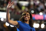First lady Michelle Obama acknowledges the crowd after delivering remarks on day one of the 2016 Democratic National Convention.