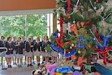 Mount Carmel choir behind the Giving Tree