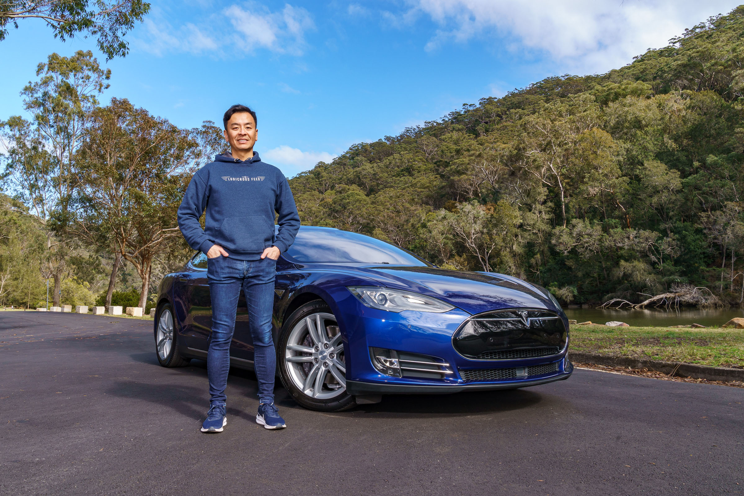 Tom Gan with one of his several Teslas