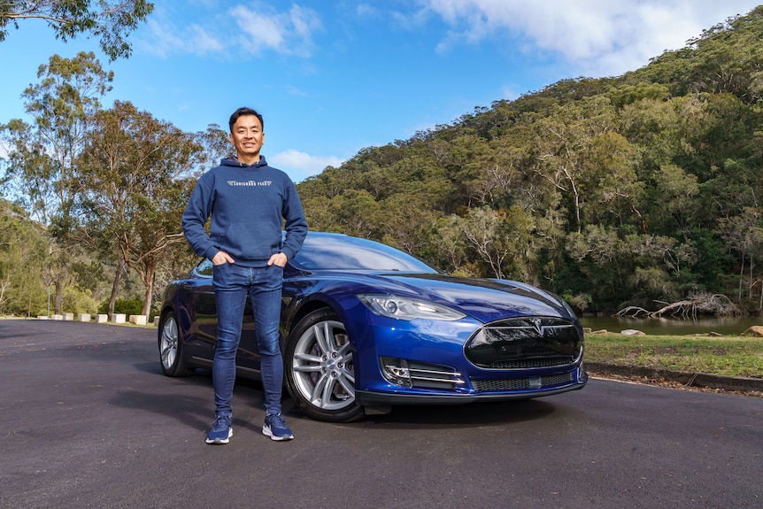 Tom Gan with one of his several Teslas