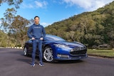 Tom Gan with one of his several Teslas