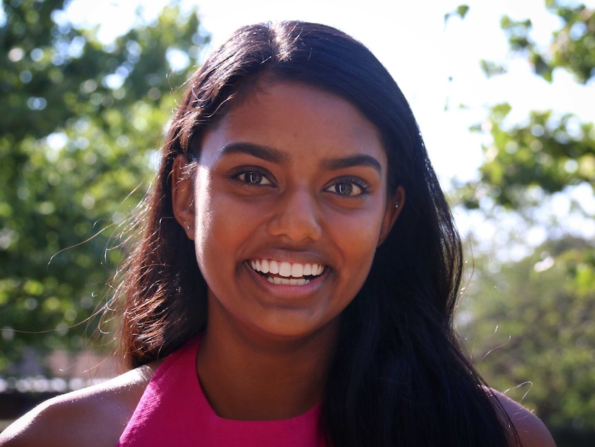 Veena Wijewickrema smiles at the camera.