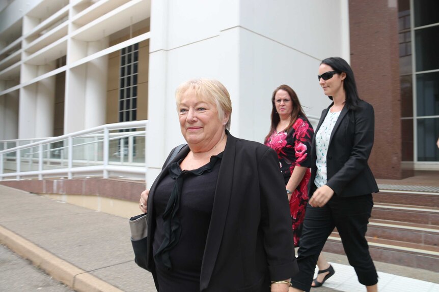 Marlene Sinclair walks in front of Clare Robinson and another woman.