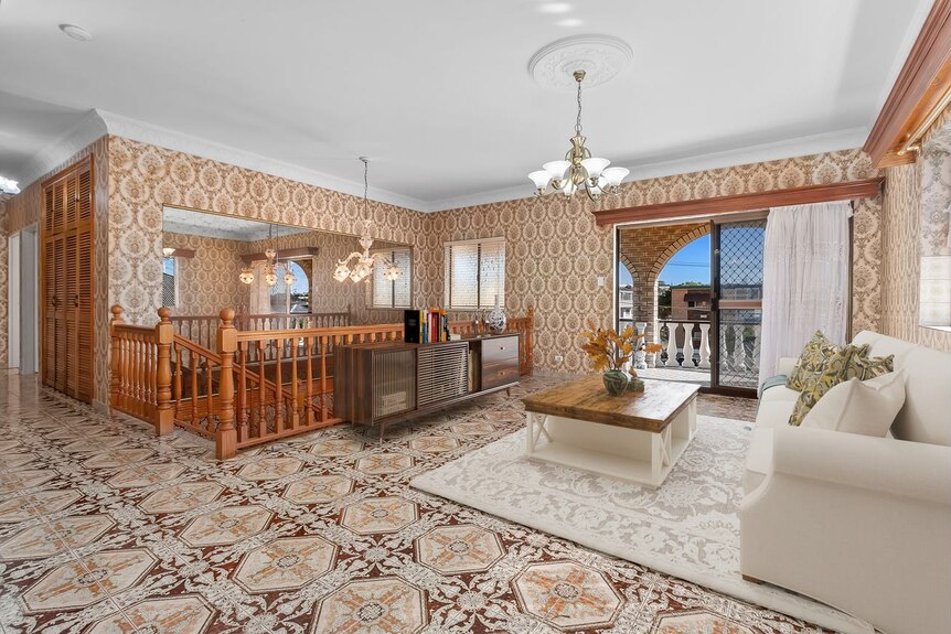 Entertaining room with ornate tiling on floor and walls