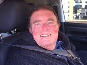 57-year-old man smiling at the camera