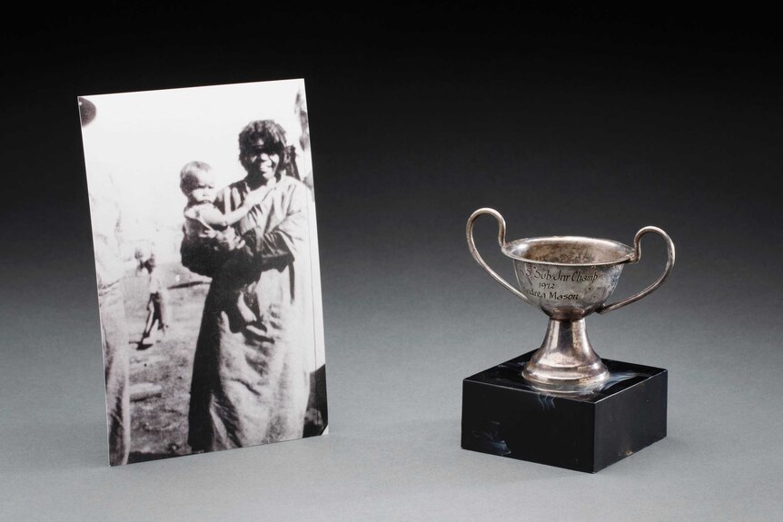 An old photograph and a trophy.